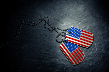 US military dog tags in the shape of the American flag. Memorial Day for Veterans Day concept. - obrazy, fototapety, plakaty