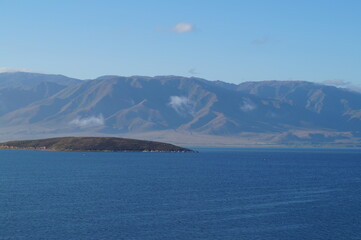 blue sea on the background of gray mountains summer morning East Kazakhstan region