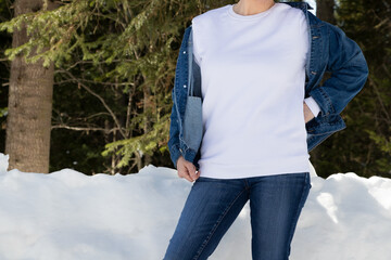 White sweatshirt mockup of a girl  in snowy winter forest, model mockup