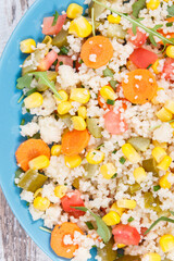 Fototapeta na wymiar Salad with vegetables and couscous groats. Light meal containing vitamins and minerals