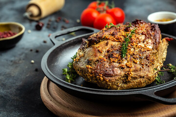 large piece of baked pork with mustard, Roast pork with herbs and vegetables. Food recipe background. Close up