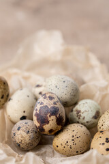 Still life. Quail eggs on a textured background. Rustic. Easter celebration concept.