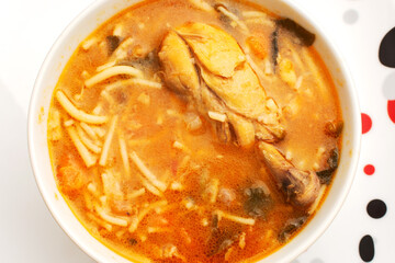Bowl with chicken soup on wooden table. Delicious homemade healthy food.