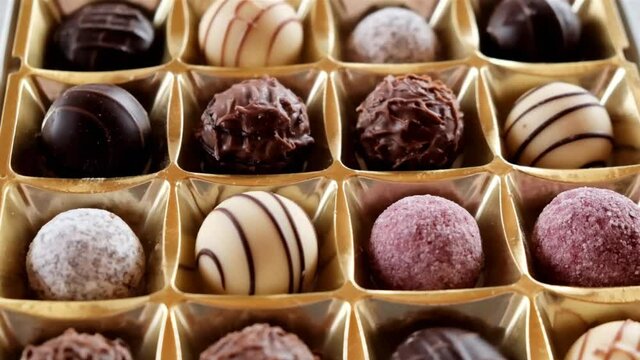 chocolate truffles assortment. Milk and dark chocolate sweets. Chocolate candy box close-up.