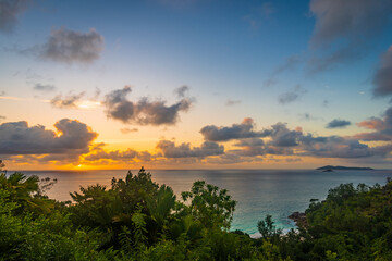 Fototapeta na wymiar Setting sun viewed from the top of Pointe Millers on Praslin island, Seychelles