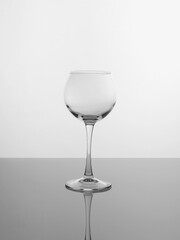 Wine glass on a light background and glass