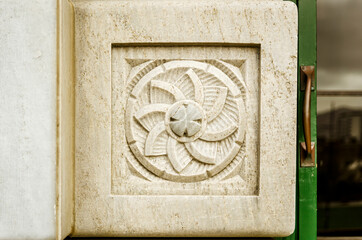 An ornament on an old building wall