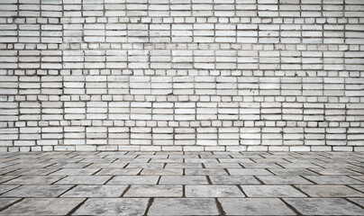 Empty room with bricks wall and tiled floor.
