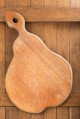 wood cutting board on dark wooden table background