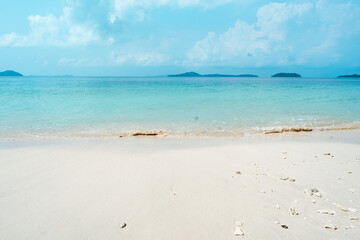 Fototapeta na wymiar Blue sea with white beach in summer