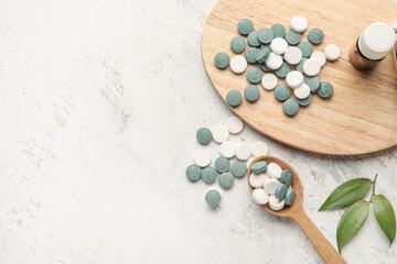 Composition with different pills on light background