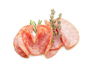 Slices of tasty salami on white background