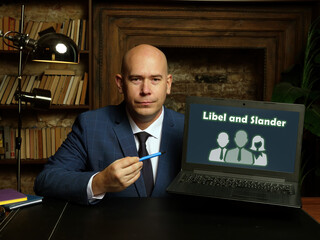 Conceptual photo about Libel and Slander with written text on the laptop.