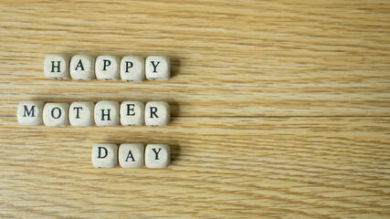The wood cube word happy mother day for holiday concept