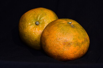 oranges on black background