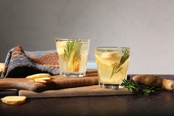Glasses of ginger lemonade on table