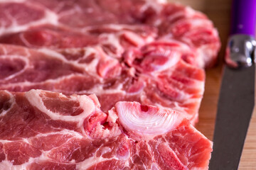 raw pork chop in a closeup