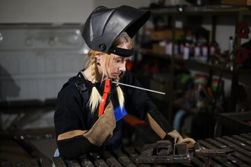 Portrait beautiful woman welder background industry factory workplace.