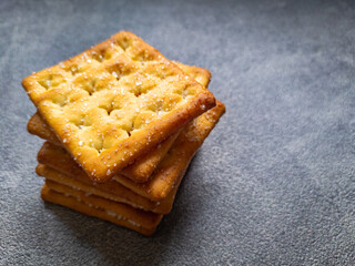 Close Up Stack of Sweet Crunchy Crackers isolated on abstract background.