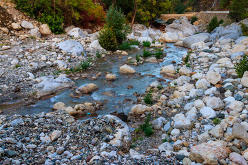 Ancient stone bridge across a mountain river in Kesme Bogaz canyon, Antalya province in Turkey