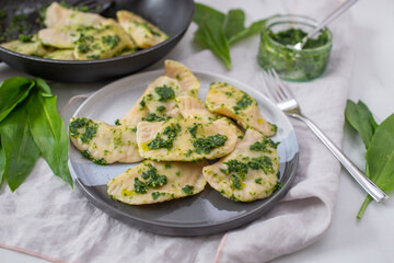 Pierogi ruskie, Baked dumplings stuffed with curd cheese and potatoes and wild garlic