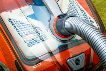 vacuum cleaner with a hose connected for cleaning close-up