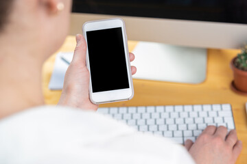 hands of women who use laptop keyboard and mobile phone. concept of email delivery and use of online technology