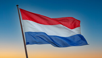 Fototapeta na wymiar Dutch flag at sunrise