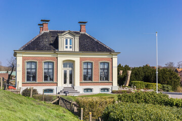 Historic house behind the dike in Zoutkamp