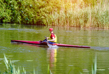 Man floating in a canoe on the river
