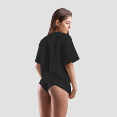 Black t-shirt mockup on young sexy girl in panties isolated on background