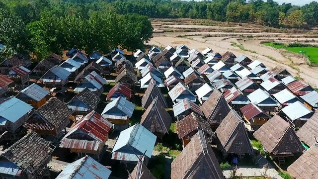 Aerial drone view Uma Lengge traditional house of Indonesia, sunny day, in Bima