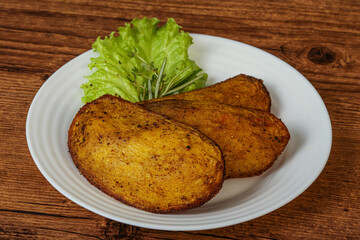 Baked potato with herbs and spices