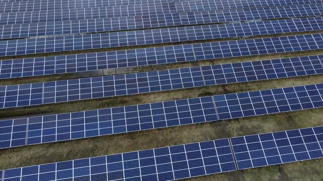 Aerial view of solar power farm with big amount of sollar cells.