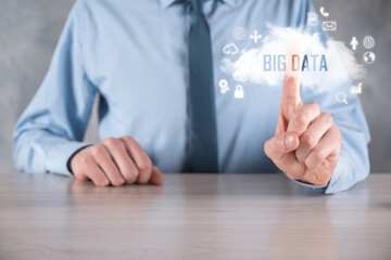 Businessman holds the inscription BIG DATA. Padlock , brain ,man, planet,graph, magnifier, gears, cloud, grid, document, letter, phone icon.