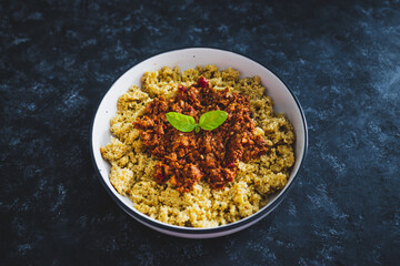 vegan bolognaise couscous with plant-based mince sauce, healthy plant-based food
