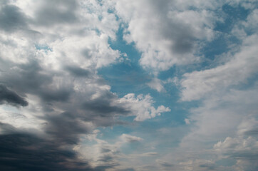 Fototapeta na wymiar Cumulus clouds on sky before the rain. Rainy weather.
