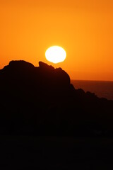 Sunset over the agitated ocean, on the skeleton coast in southern Namibia.