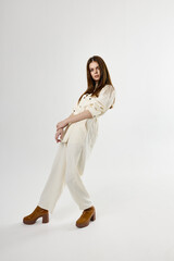 pretty woman in white jumpsuit fashion glamor isolated background