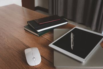 Essential accessories of working on table at office workplace.  pen laptop mouse device notebook mobile phone .copy space. Business and finance idea objects concept background.