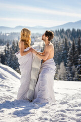 couple in blankets in winter