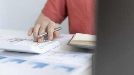 Accounting businesswomen are calculating income-expenditure and analyzing real estate investment data, Dedicated to the progress and growth of the company, Financial and tax systems concept.