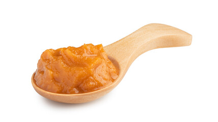 vegetable puree in a special wooden spoon for sauces isolated on white