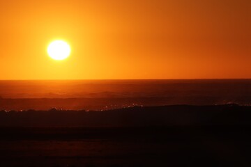Sunset over the agitated ocean, on the skeleton coast in southern Namibia.
