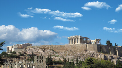 Acropolis hill and the Parthenon, Attica, Greece. Famous old Acropolis hill is a top landmark of Athens on a spring cloudy morning with deep blue sky