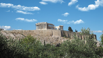 Acropolis hill and the Parthenon, Attica, Greece. Famous old Acropolis hill is a top landmark of Athens on a spring cloudy morning with deep blue sky