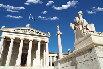 Beautiful neoclassic Academy of Athens public landmark building with beautiful spring clouds and deep blue sky, Athens historic centre, Attica, Greece
