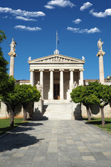 Obraz premium Beautiful neoclassic Academy of Athens public landmark building with beautiful spring clouds and deep blue sky, Athens historic centre, Attica, Greece