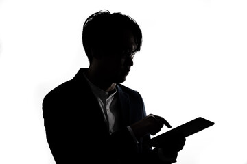 Silhouette of businessman use tablet isolate on  white background. Concept for business and online technology.