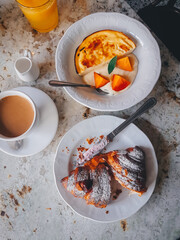 Breakfast in a cafe on a marble table, Closeup, Atmospheric photo, Lifestyle, Paris, Croissants and cheesecake, Photo with hands, Selecive focus